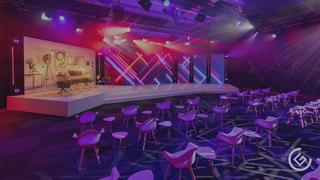 Ein dunkles Studio wird durch eine LED-Wand und Bühnen-Kombination zum Leuchten erweckt. Im Vordergrund stehen mehrere Stühle für Besucher. Der Boden, die Wände und die Decke sind durch Strahler bunt beleuchtet.